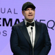 Kevin Feige wears a tuxedo and a ball cap at the 35th Annual American Cinematheque Awards.